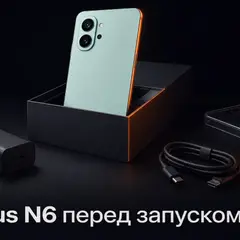 Мятный смартфон в открытой коробке как символ распаковки OnePlus N6